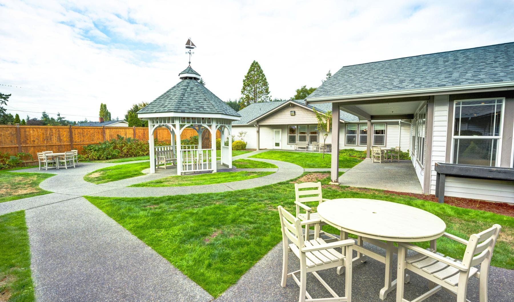 The essence of exceptional living a backyard with a table and chairs