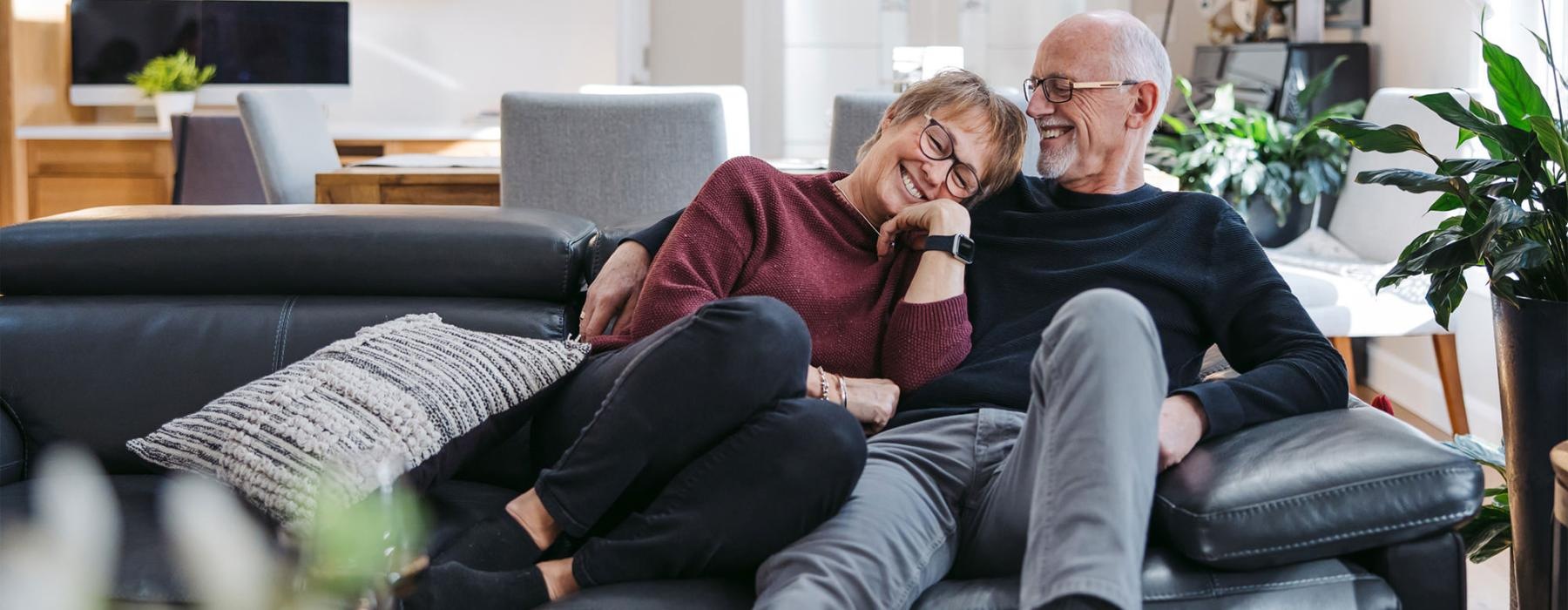 a man and woman sitting on a couch