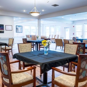 Find your perfect fit at HomePlace Special Care at Oak Harbor a large room with tables and chairs